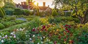 image of flower garden outside the main house
