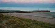 sea with the tide out taken from sand dunes on Littlehampton west beach