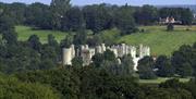 National Trust Bodiam Castle from after, the towers of the castle, fields and woodlands surrounding the castle