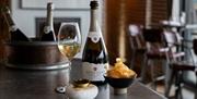 Caviar and sparkling wine on bar