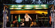 Rum and Reggae night - singer and band playing on a stage