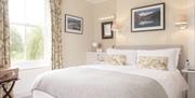bedroom with double bed and large window
