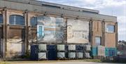 the sidings wall with two giant artworks of the riverside as part of an installation in previous years.