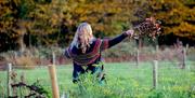 a woman in standing in a field