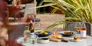 terra restaurant food outside on a table with a plant in the TERRA Courtyard at Tottington Manor