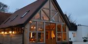 Exterior shot of restaurant at the Black Horse at night