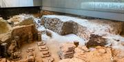 The exposed remains of the 2,000-year-old Roman bath house below The Novium Museum, Tower Street, Chichester