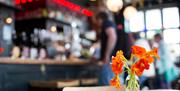flowers on the table inside the pub