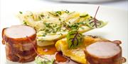 a plate of food delicately arranged