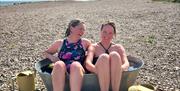Two women sat in cold tub post sauna