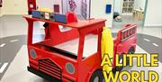 Wooden fire engine in children's play area at Little Street