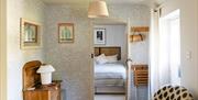 view from entrance hall way into the bedroom