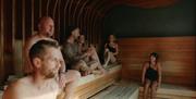 South Lodge spa interior, people enjoying sauna