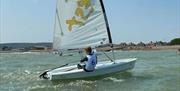dinghy sailing off Eastbourne beach