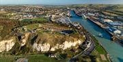 aerial shot of newhaven fort in the foreground from above with the river and town in the distance