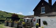 Tottington Manor hotel near Brighton with views of the South Downs National Park and our outdoor dining areas.