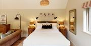 King size bed in The Potager cabin